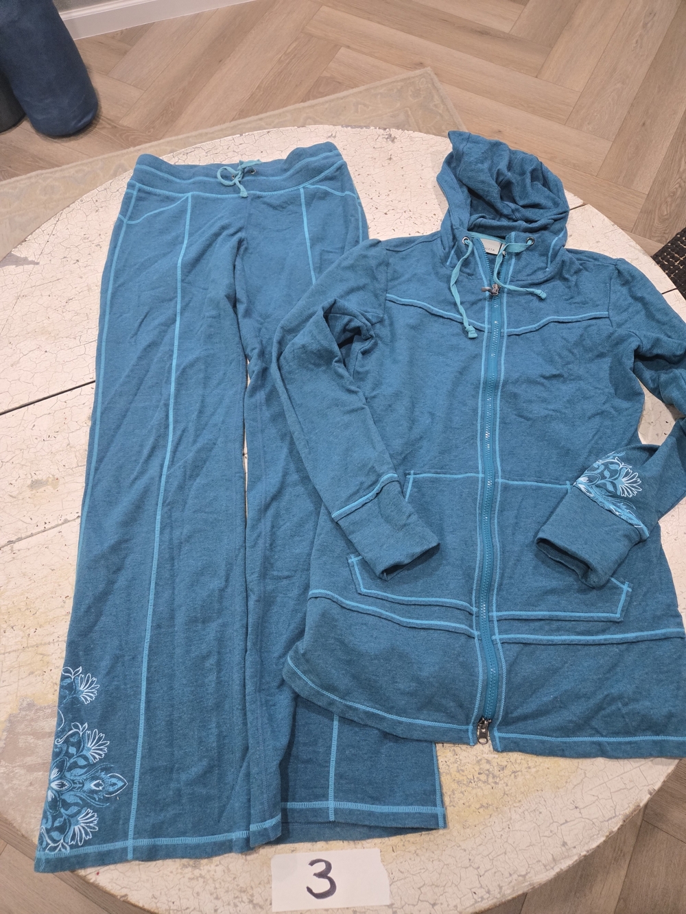 Athleta teal blue tracksuit features a zip-up hoodie and matching pants Size XS